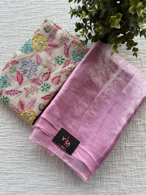 Emb blouse with shiny tissue organza saree